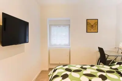 Télévision ou salle de divertissement dans l'établissement Appartement haut standing avec sauna
