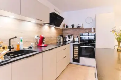 Cuisine ou kitchenette dans l'établissement Appartement haut standing avec sauna
