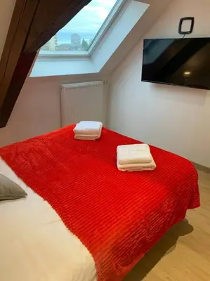 Un ou plusieurs lits dans un hébergement de l'établissement Esprit Espagne, joli studio au coeur de Mulhouse
