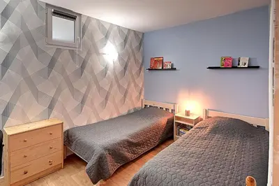 Un ou plusieurs lits dans un hébergement de l'établissement Entre Lac et Montagne - Appt pour 4 - Garage privé