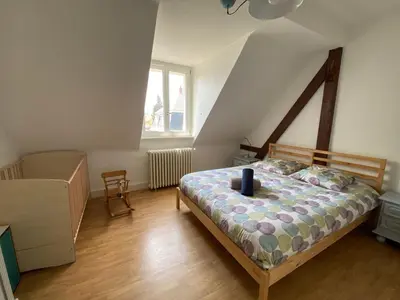 Un ou plusieurs lits dans un hébergement de l'établissement BookingAlsace - Maison Mittelharth Parking Jardin