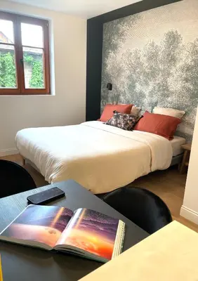 Un ou plusieurs lits dans un hébergement de l'établissement L'Adresse Studio Rempart sud - centre historique Eguisheim