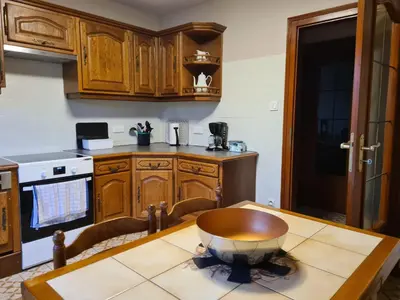 Cuisine ou kitchenette dans l'établissement Gîte 