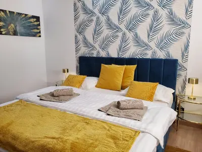 Un ou plusieurs lits dans un hébergement de l'établissement Mirka & Franck AIRCON CLIM, Apartment Chic, Parking Free, Avantages Packs Bookables
