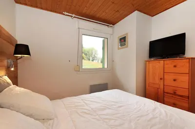 Un ou plusieurs lits dans un hébergement de l'établissement Domaine des Chênes Rouges - Appt 3 étoiles pour 4p dans chalet