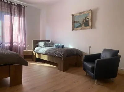 Un ou plusieurs lits dans un hébergement de l'établissement Bel appartement spacieux T4 La Citadelle de 92m2