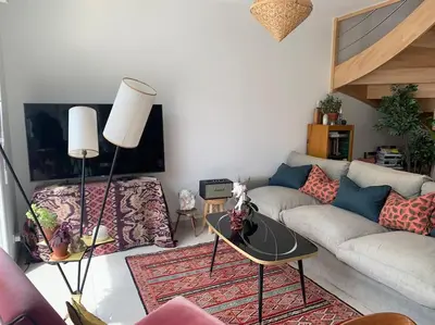 Coin salon dans l'établissement Maison des mésanges