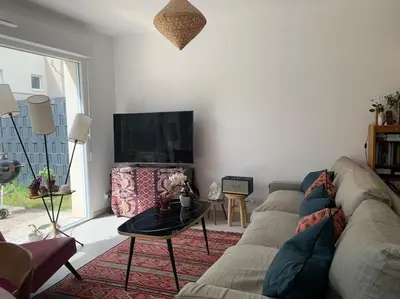 Coin salon dans l'établissement Maison des mésanges