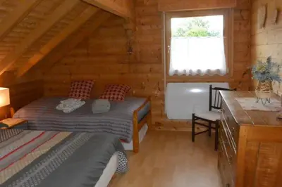 Un ou plusieurs lits dans un hébergement de l'établissement Chalet sous Le Théâtre