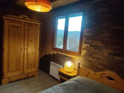 Un ou plusieurs lits dans un hébergement de l'établissement Chalet L'envolée Bleue