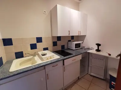Cuisine ou kitchenette dans l'établissement La grange de Joséphine