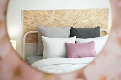Un ou plusieurs lits dans un hébergement de l'établissement Le CLOONEY - appartement en duplex - Hyper centre