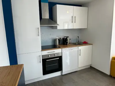 Cuisine ou kitchenette dans l'établissement Charmant studio avec terrasse