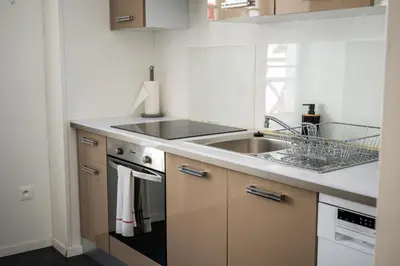 Cuisine ou kitchenette dans l'établissement Le 42-GregIMMO-Appart'Hôtel