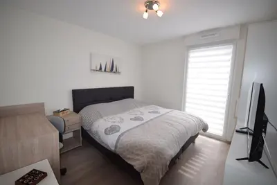 Un ou plusieurs lits dans un hébergement de l'établissement Appartement Sélestat