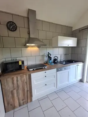 Cuisine ou kitchenette dans l'établissement Au Calme Des Vosges