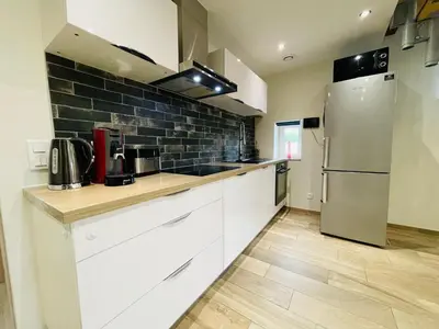 Cuisine ou kitchenette dans l'établissement Gîte du Tonnelier
