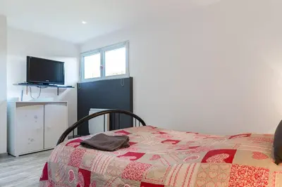 Un ou plusieurs lits dans un hébergement de l'établissement Spacieux appartement dans le vignoble