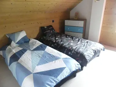 Un ou plusieurs lits dans un hébergement de l'établissement LE MASSIF - Appartement au sommet avec vue panoramique