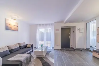 Coin salon dans l'établissement Appartement Bandjoun - Pour 4 à Mulhouse