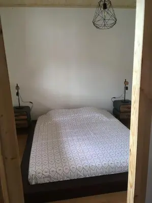 Un ou plusieurs lits dans un hébergement de l'établissement Appartement le Syöté