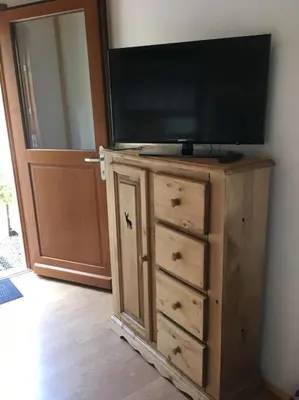Télévision ou salle de divertissement dans l'établissement Appartement le Syöté