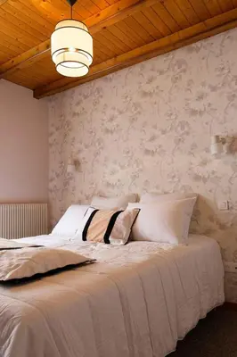 Un ou plusieurs lits dans un hébergement de l'établissement Maison Capdet
