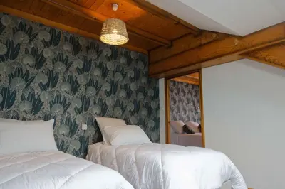 Un ou plusieurs lits dans un hébergement de l'établissement Maison Capdet
