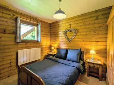 Un ou plusieurs lits dans un hébergement de l'établissement Appartement cosy avec parking et terrasse à Gérardmer - FR-1-589-653