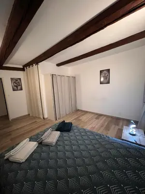 Un ou plusieurs lits dans un hébergement de l'établissement Spacieux 61 metres carré tout confort