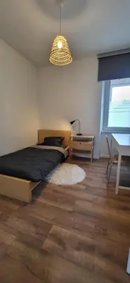 Un ou plusieurs lits dans un hébergement de l'établissement Appartement lumineux 2 chambres