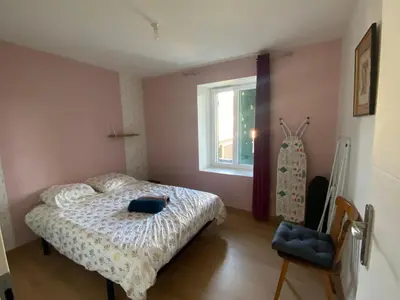 Un ou plusieurs lits dans un hébergement de l'établissement Appartement coquet avec 3 chambres en face des pistes de ski