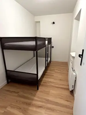 Un ou plusieurs lits dans un hébergement de l'établissement Appartement proche La Bresse