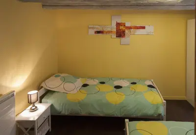 Un ou plusieurs lits dans un hébergement de l'établissement Gîte les Cigogneaux