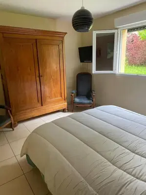 Un ou plusieurs lits dans un hébergement de l'établissement Maison avec jardin Gérardmer L'AUTOUR