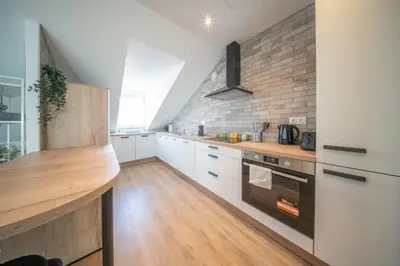 Cuisine ou kitchenette dans l'établissement Superbe appartement climatisé parking free