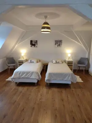 Un ou plusieurs lits dans un hébergement de l'établissement Chez Pépé Frantz Maison spacieuse et confortable