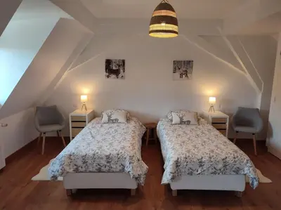 Un ou plusieurs lits dans un hébergement de l'établissement Chez Pépé Frantz Maison spacieuse et confortable