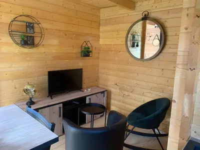 Télévision ou salle de divertissement dans l'établissement Chalet