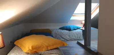 Un ou plusieurs lits dans un hébergement de l'établissement Maison Cosy Mulhouse