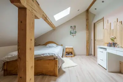 Un ou plusieurs lits dans un hébergement de l'établissement La Ferme aux Myrtilles - Ancienne ferme vosgienne