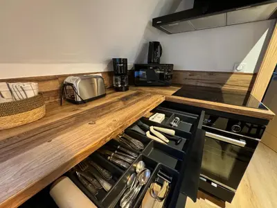 Cuisine ou kitchenette dans l'établissement Gite Premium au grenier de l'Ours