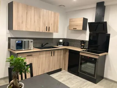 Cuisine ou kitchenette dans l'établissement Maisonnette
