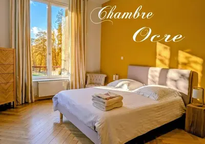 Un ou plusieurs lits dans un hébergement de l'établissement Chambres d'hôtes au Château Léon