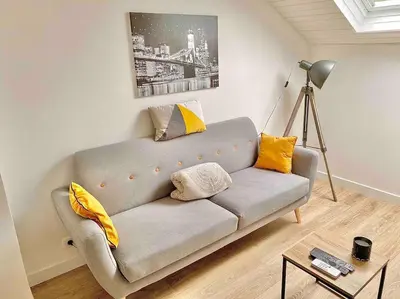 Coin salon dans l'établissement L appartement du Fayé