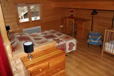 Un ou plusieurs lits dans un hébergement de l'établissement Chalet de la Lette