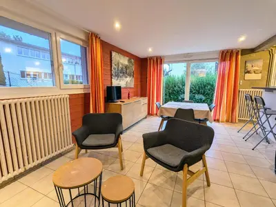 Coin salon dans l'établissement Gîte cosy au cœur de Gérardmer avec jardin et terrasse - FR-1-589-670