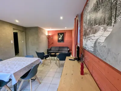 Coin salon dans l'établissement Gîte cosy au cœur de Gérardmer avec jardin et terrasse - FR-1-589-670