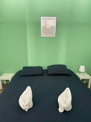 Un ou plusieurs lits dans un hébergement de l'établissement Cosy 1 - Montbéliard centre 80m2
