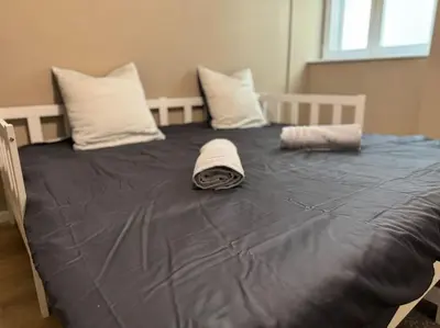 Un ou plusieurs lits dans un hébergement de l'établissement Appartement proche place de la réunion au calme